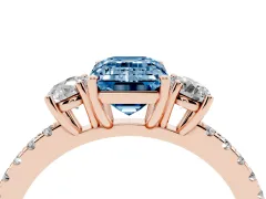 Fancy Blue Emerald Cut Diamond Three-Stone Ring Set in Rose gold with Pavé Band and Graduated Sides