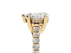 Pear Cut Diamond Solitaire Ring Set in Yellow gold with Brilliant Pavé Band and Prong Setting