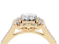 Emerald Cut Diamond Halo Ring Set in Yellow gold with Pavé-Lined Shoulders and Prong Setting