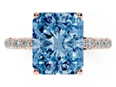 Fancy Blue Radiant Cut Diamond Solitaire Engagement Ring Set in Rose gold with Round Pavé Band and Prong Setting