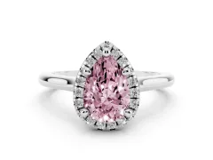 Fancy Pink Pear Cut Diamond Halo Engagement Ring Set in White gold with Pavé Band and Rising Shoulders