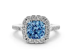 Fancy Blue Cushion Cut Diamond Pavé Halo Ring Set in Platinum with Prong Setting