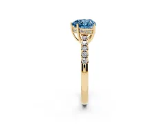 Fancy Blue Heart Cut Diamond Solitaire Engagement Ring Set in Yellow gold with Pavé Band and Prong Setting