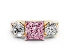 Fancy Pink Princess Cut Diamond Three-Stone Ring Set in Yellow gold with Round Side Stones and Classic Band