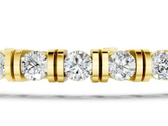 Round Brilliant Diamond Tennis Bracelet Set in Yellow gold with Channel Set Stones and Box Clasp