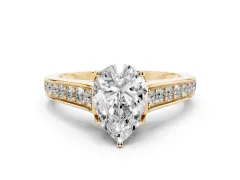 Pear Cut Diamond Solitaire Pavé Engagement Ring Set in Yellow gold with Prong Setting