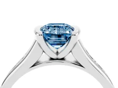 Fancy Blue Emerald Cut Diamond Bezel-Set Solitaire Ring Set in White gold with Channel-Set Band