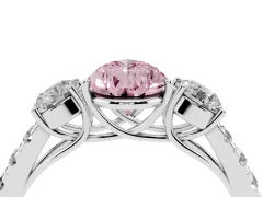Fancy Pink Pear Cut Diamond Three-Stone Ring Set in Platinum with Round Side Stones and Delicate Pavé Band