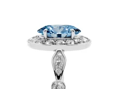 Fancy Blue Oval Cut Diamond Halo Engagement Ring Set in White gold with Twisted Band and Prong Setting