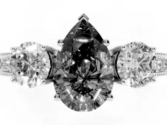 Fancy Black Pear Cut Diamond Three-Stone Ring Set in White gold with Round Side Stones and Pavé Band