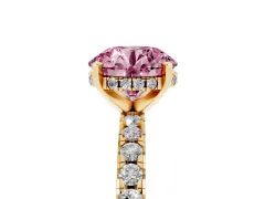 Fancy Pink Round Cut Diamond Pavé Solitaire Ring Set in Yellow gold with Round Band Accents and Prong Setting