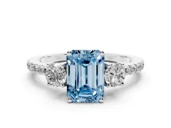 Fancy Blue Emerald Cut Diamond Three-Stone Ring Set in Platinum with Pavé Band and Graduated Sides