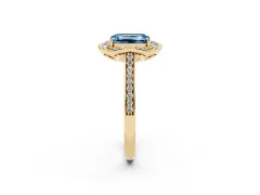 Fancy Blue Emerald Cut Diamond Halo Ring Set in Yellow gold with Pavé-Lined Shoulders and Prong Setting
