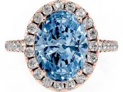 Fancy Blue Oval Cut Diamond Pavé Halo Engagement Ring Set in Rose gold with Pavé Band and Prong Setting