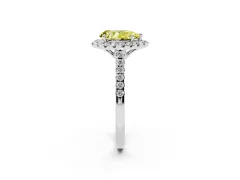 Fancy Yellow Pear Cut Diamond Pavé Halo Engagement Ring Set in Platinum with Pavé Band and Prong Setting