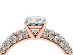 Emerald Cut Diamond Pavé Band Solitaire Ring Set in Rose gold with Close-Set Accent Stones and Prong Setting