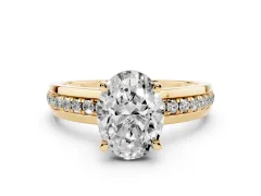 Oval Cut Diamond Solitaire Ring Set in Yellow gold with Channel Set Band and Prong Setting