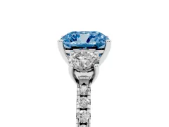 Fancy Blue Cushion Cut Diamond Three-Stone Ring Set in Platinum with Pavé Band and Graduated Sides