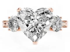 Heart Cut Diamond Three-Stone Ring Set in Rose gold with Pavé Band and Smaller Side Stones