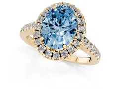Fancy Blue Oval Cut Diamond Pavé Halo Engagement Ring Set in Yellow gold with Pavé Band and Prong Setting
