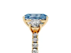 Fancy Blue Emerald Cut Diamond Three-Stone Ring Set in Yellow gold with Pavé Band and Graduated Sides
