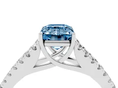 Fancy Blue Emerald Cut Diamond Split Shank Pavé Engagement Ring Set in White gold with Prong-Held Center Stone