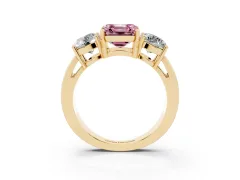 Fancy Pink Asscher Cut Diamond Three-Stone Ring Set in Yellow gold with Round Side Stones and Classic Band