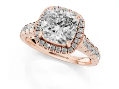 Cushion Cut Diamond Halo Engagement Ring Set in Rose gold with Pavé Band and Prong-Set Center