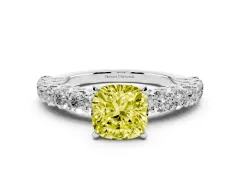 Fancy Yellow Cushion Cut Diamond Solitaire Ring Set in White gold with Shared Prong Pavé Band