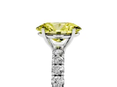 Fancy Yellow Oval Cut Diamond Pavé Solitaire Engagement Ring Set in White gold with Prong Setting