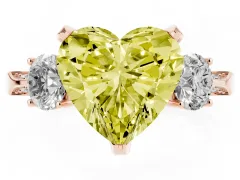 Fancy Yellow Heart Cut Diamond Three-Stone Ring Set in Rose gold with Pavé Band and Smaller Side Stones