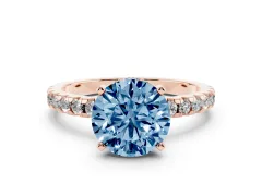 Fancy Blue Round Cut Diamond Pavé Solitaire Ring Set in Rose gold with Round Band Accents and Prong Setting