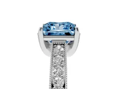 Fancy Blue Princess Cut Diamond Solitaire Ring Set in Platinum with Milgrain-Edged Pavé Band and Prong Setting