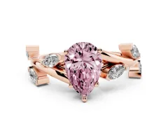 Fancy Pink Pear Cut Diamond Solitaire Ring Set in Rose gold with Twisted Marquise Accent Band