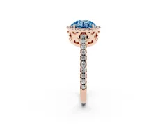 Fancy Blue Round Cut Diamond Halo Ring Set in Rose gold with Pavé Shoulders and Halo-Framed Center