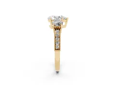 Pear Cut Diamond Three-Stone Ring Set in Yellow gold with Round Side Stones and Pavé Band