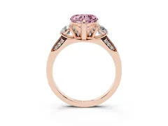 Fancy Pink Heart Cut Diamond Three-Stone Ring Set in Rose gold with Pavé Band and Smaller Side Stones