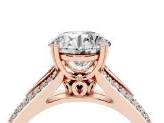 Round Cut Diamond Split Shank Pavé Engagement Ring Set in Rose gold with Prong-Set Center Stone