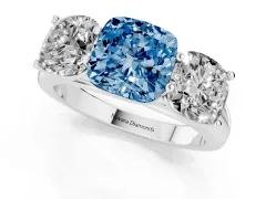 Fancy Blue Cushion Cut Diamond Three-Stone Ring Set in Platinum with Plain Polished Band