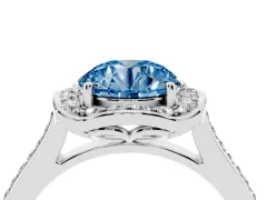 Fancy Blue Round Cut Diamond Halo Ring Set in Platinum with Pavé-Lined Shoulders and Prong Setting