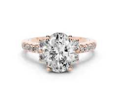 Oval Cut Diamond Three-Stone Pavé Ring Set in Rose gold with Prong Setting