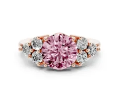 Fancy Pink Round Cut Diamond Solitaire Ring Set in Rose gold with Cluster Accents on Each Side