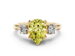 Fancy Yellow Pear Cut Diamond Three-Stone Ring Set in Yellow gold with Pavé Band and Smaller Side Stones