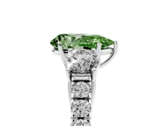 Fancy Green Pear Cut Diamond Three-Stone Ring Set in Silver with Round Side Stones and Delicate Pavé Band