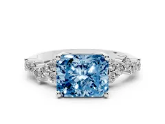 Fancy Blue Radiant Cut Diamond Ring Set in White gold with Scattered Round Accents