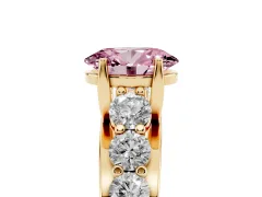 Fancy Pink Oval Cut Diamond Pavé Engagement Ring Set in Yellow gold with Prong Setting