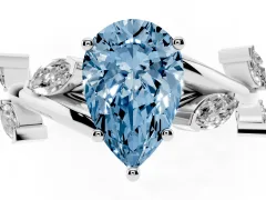Fancy Blue Pear Cut Diamond Solitaire Ring Set in Platinum with Twisted Marquise Accent Band