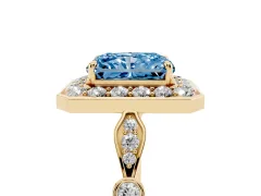 Fancy Blue Radiant Cut Diamond Halo Engagement Ring Set in Yellow gold with Twisted Band and Prong Setting