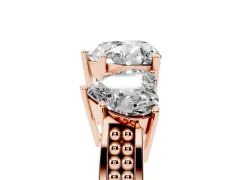 Heart Cut Diamond Three-Stone Ring Set in Rose gold with Textured Band