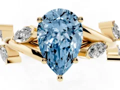 Fancy Blue Pear Cut Diamond Solitaire Ring Set in Yellow gold with Twisted Marquise Accent Band